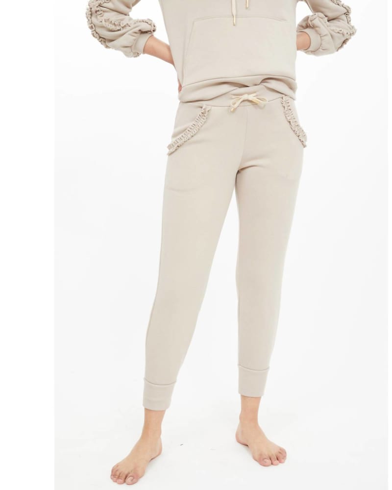 Front of a model wearing a size L Asta Ruffle Sweatpants In Jet Stream in Jet Stream by Generation Love. | dia_product_style_image_id:352079